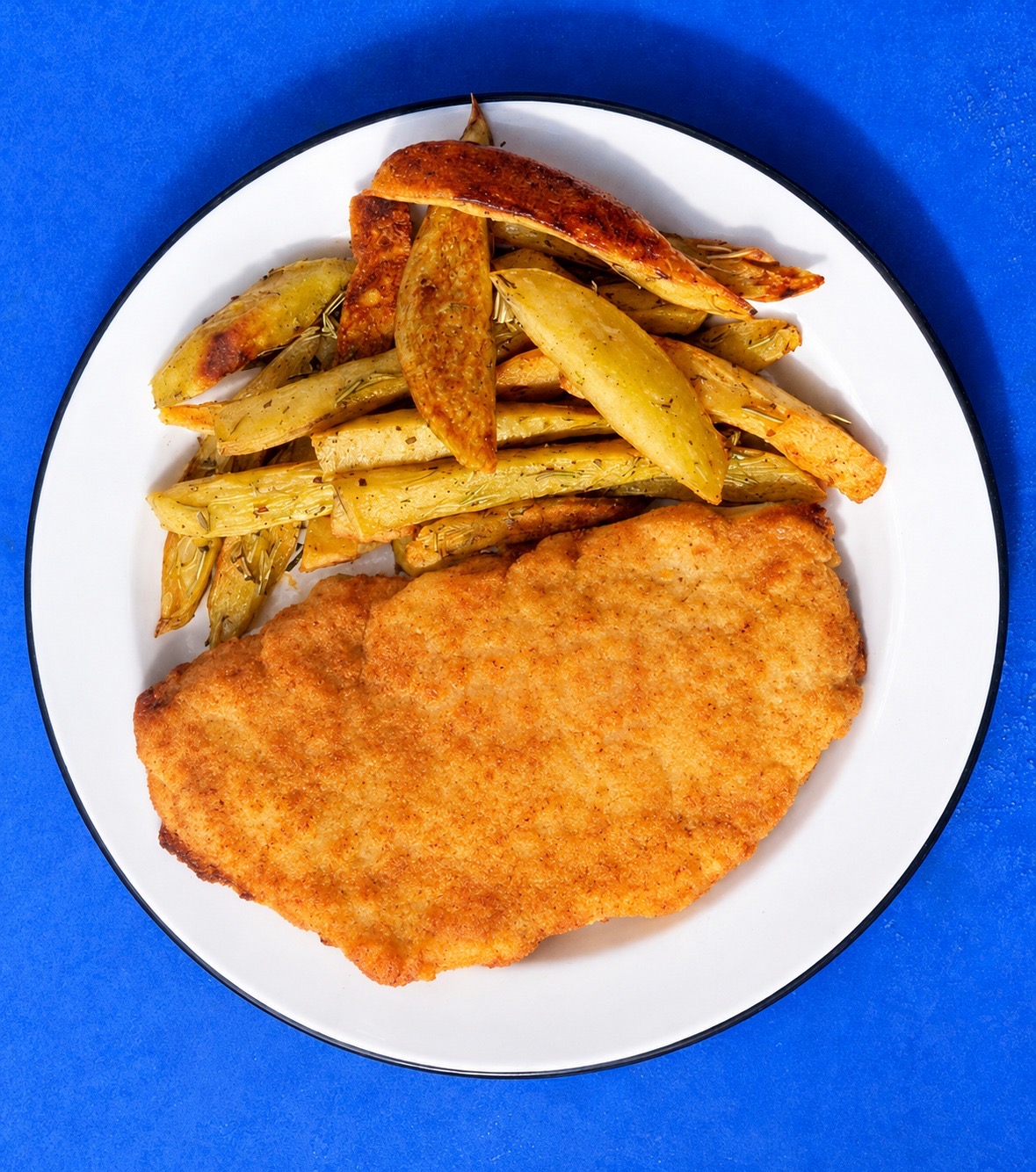 Vianda de milanesa con papas rústicas al horno